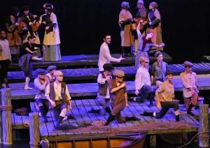 The cast members of Peter Grimes dance in the opening scene