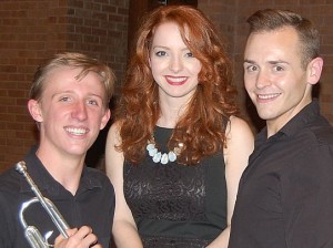 A photo of trumpet player Eric Meincke with Praeclara vocalists Kelly Singer and Jonathan Pillow