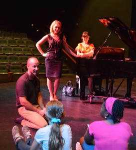 Bevan Keating, Kyung-Eun Na, and a WAMA guest artist coach two young female singers at WAMA