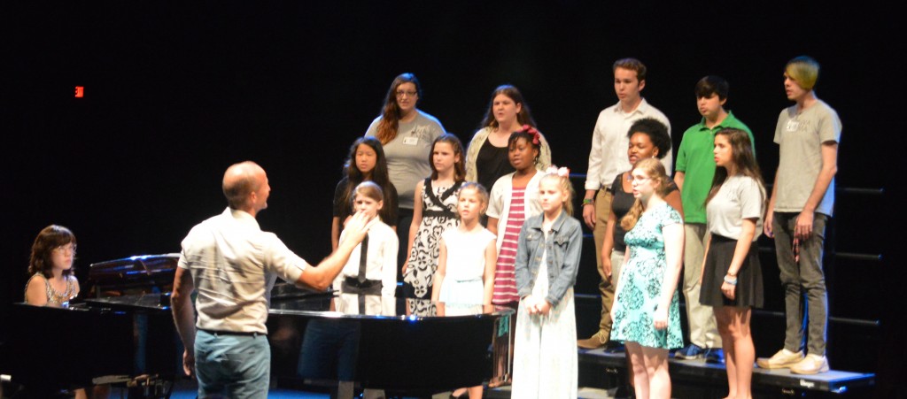 Bevan Keating conducts a choir of teenaged vocalists at WAMA, accompanied by collaborative artist Kyung-Eun Na